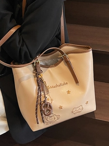 Minimalist beige embroidery tote bag with brown straps and cute cat pattern