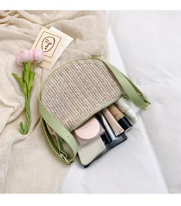 Detail of spacious straw dumpling bag showing makeup items inside on soft bedding