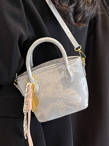 Elegant light gray marble bucket bag with gold hardware and silk scarf decoration