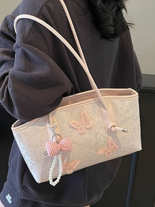 Pink embroidered butterfly tote bag with pearl charm accessory for women's elegant daily use