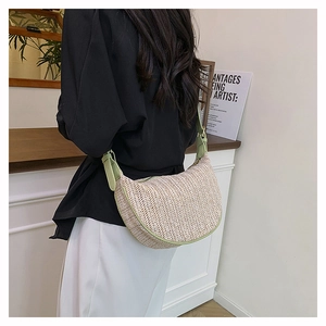 Detail of striped woven dumpling bag with light green PU leather strap and metal buckle