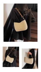 Detail of hand-woven beige straw bag with amber resin chain strap and wave texture