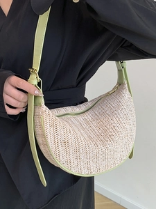 Minimalist straw crescent shoulder bag with avocado green leather trim for summer