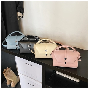 Chic women's crossbody square bags in four trendy colors with metallic clasps and handles