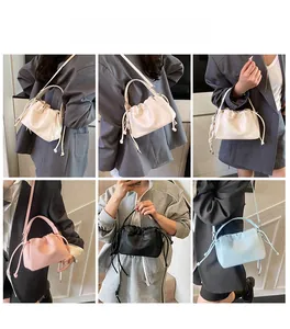 Detail shots of lychee pattern pleated crossbody bag in white, pink, black and blue