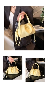 Detail of light yellow ruched bucket bag with drawstring closure and pebble grain texture