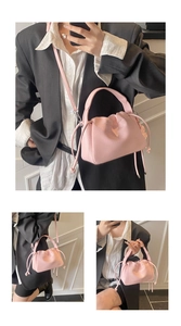Detailed views of pink pleated bucket bag with lychee texture and drawstring accents