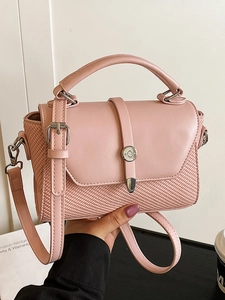 Pink minimalist crossbody bag with woven texture and top handle for women