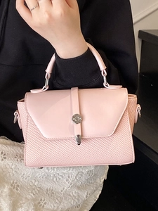 Pink minimalist crossbody bag with woven texture and silver metal rotating lock