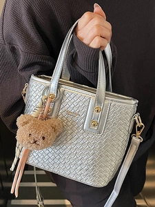 Silver woven texture bucket bag with handles, shoulder strap, and cute bear charm