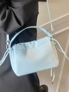 Light blue lychee pattern pleated handbag with adjustable shoulder strap and drawstring