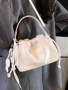 Chic cream lychee grain leather crossbody bag with pleated design and elegant top handle