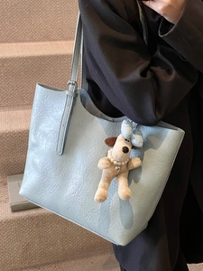 Minimalist light blue large capacity tote bag with cute dog pendant accessory for women