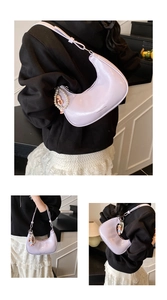 Detailed views of a light purple crescent bag with pearl charm and fashion logo print