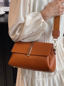Chic brown litchi leather crossbody bag for women with gold clasp and wide strap