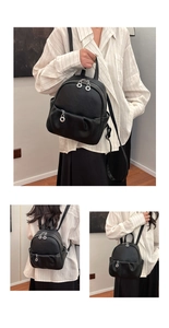 Detail view of mini black pebble leather backpack with three silver ring zippers