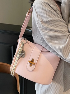 Minimalist light pink oil wax leather shoulder bag with tennis racket pendant for women