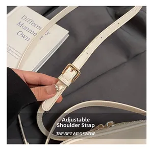 Detail showing adjustable leather strap with golden buckle and pre-drilled holes