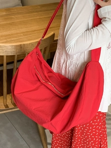 Large capacity red shoulder bag with wide strap in lightweight nylon hobo crescent design