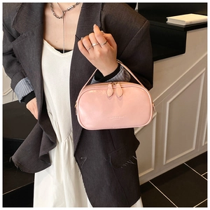 Detail of light pink oil wax leather handbag with FASHION & BAGS double zipper