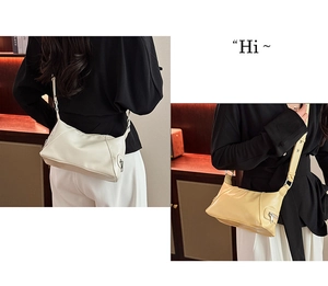 Detail view of smooth PU leather tote bag with functional side zipper and adjustable strap