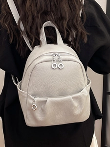 Chic light gray lychee pattern leather mini backpack for women, shown on person