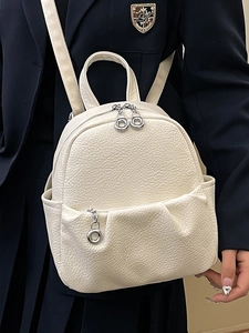 Creamy white lychee texture mini backpack with silver hardware for casual chic style