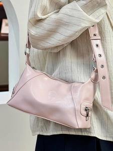 Chic light pink crescent tote bag in glossy PU leather with eyelet strap details