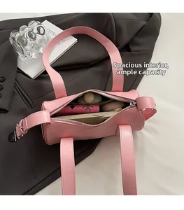 Pink baguette bag interior showing spacious storage for phone, lipstick and makeup items