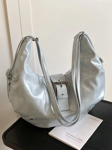 Metallic blue Y2K hobo tote bag with oversized buckle and versatile double straps