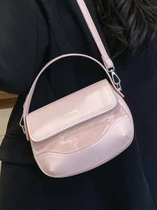 Minimalist light pink leather saddle bag for women with silver logo and crossbody strap