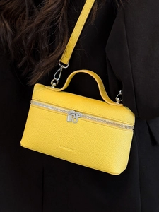 Yellow litchi grain leather crossbody bag with silver zipper and top handle for women