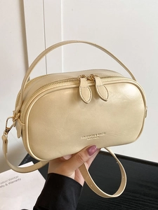 Chic cream-colored oil wax leather crossbody bag with top handle for women