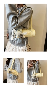 Detail of cream bowling shoulder bag with silver heart charm and lace ribbon decoration