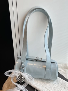 Light blue cylinder baguette shoulder bag with lace bow and silver heart charm accessory