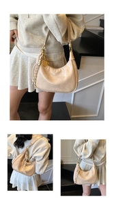 Detail of beige hobo bag with oily wax texture leather and woven rope ornament