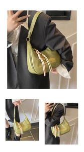Detail of light green oil wax tote bag with tassels and model styling perspective