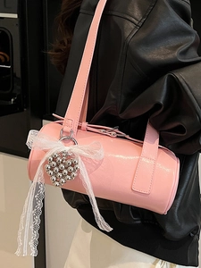 Pink cylinder baguette bag with white lace bow and heart charm for stylish commuting