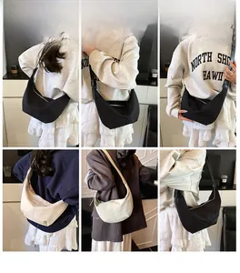 Detailed views of nylon crescent hobo bag shown in black and cream on models