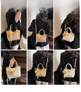 Litchi texture crossbody bucket bag shown from multiple angles with bear charm