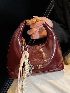 French style dark burgundy glossy leather crescent handbag with elegant gold hardware