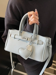 Elegant light blue lychee pattern leather handbag with top handle and heart charm