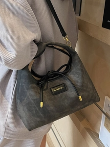 Deep grey vintage hobo bag with gold logo and stylish knot details for women