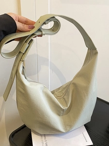 Minimalist light mint green nylon hobo shoulder bag with adjustable strap and zip closure