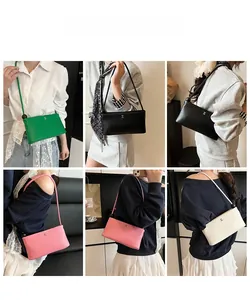 Dettaglio ravvicinato della borsa a tracolla con logo H in quattro colori eleganti