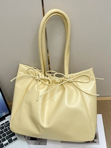 Chic cream yellow soft PU leather tote bag with stylish bow drawstrings for women