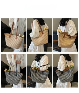 Detail view of woven straw tote bags in light brown and black-white mix with leather straps