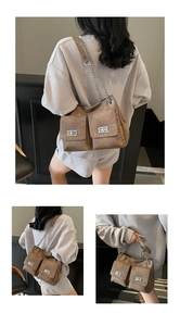 Détail du sac cabas marron vintage avec deux poches avant et fermoirs rotatifs argentés