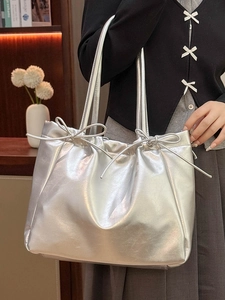 Silver metallic soft leather tote bag with bow detail and drawstring for women