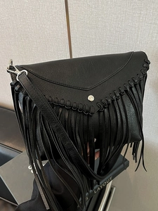 Retro Bohemian black fringe crossbody bag with woven details and tassel accents